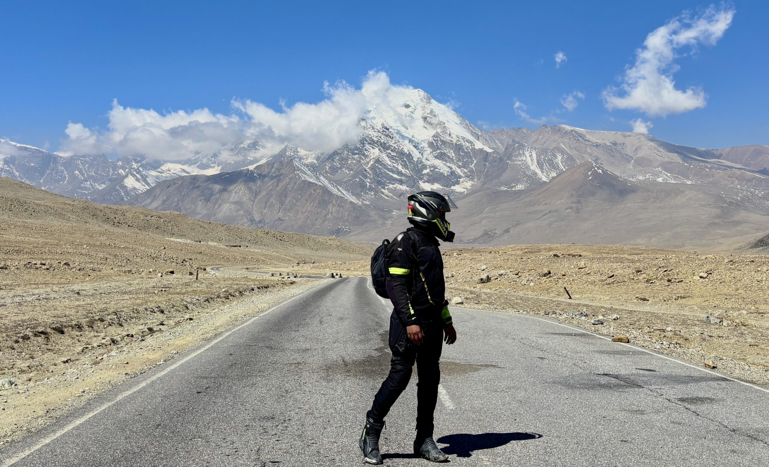 Riders at the highest café in India with bikes parked outside