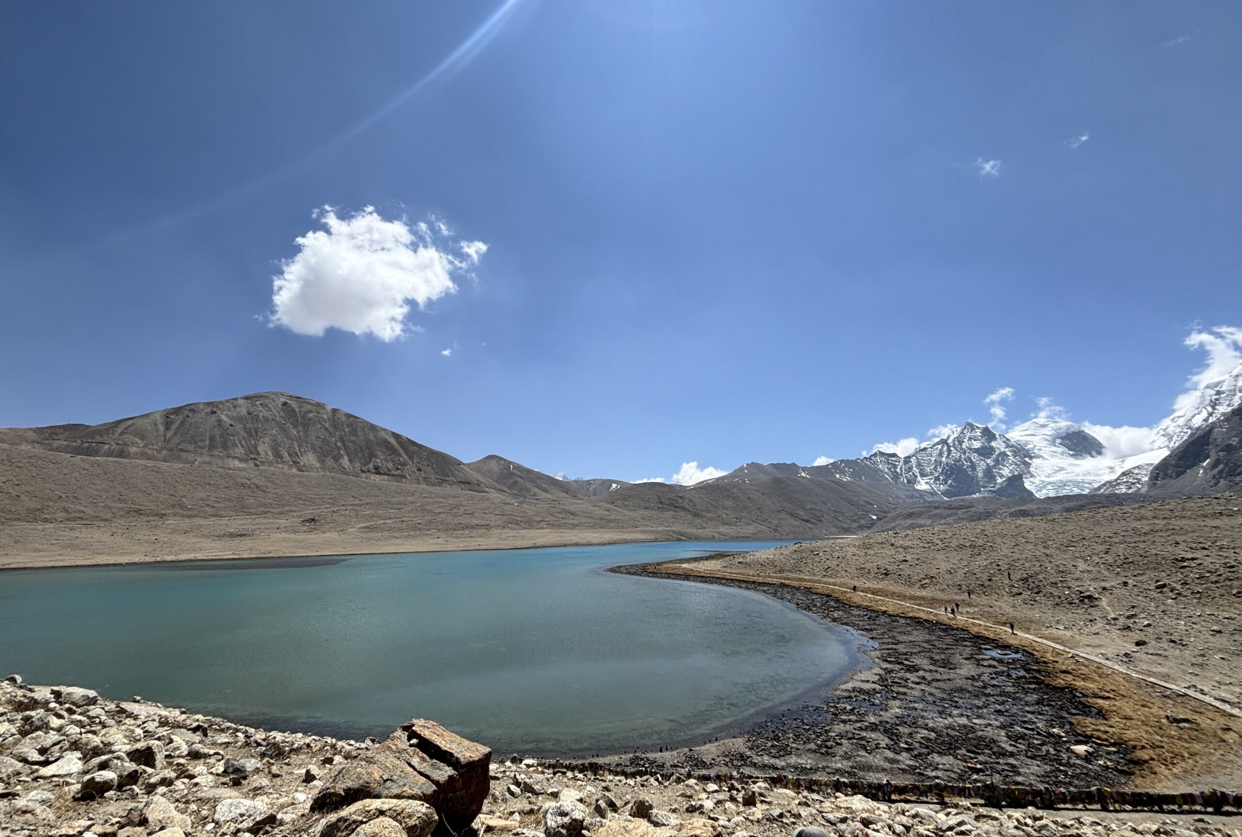 Gurudongmar Lake view, frozen and turquoise under clear blue sky